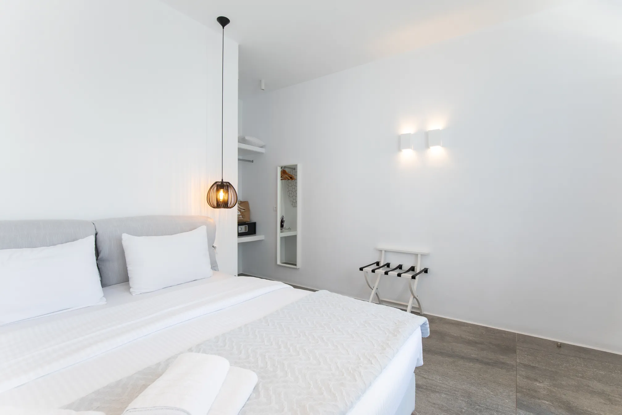 Bed corner with rattan pendant lamp